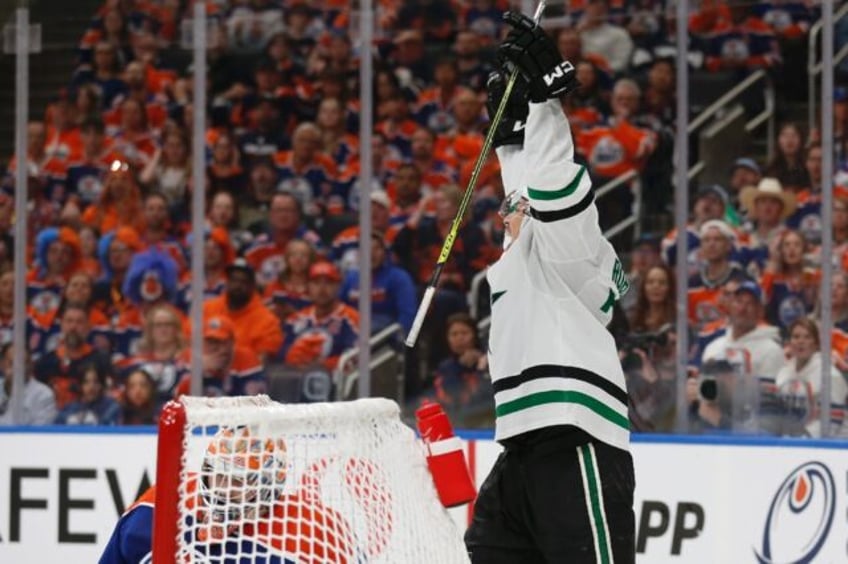 Jason Robertson of the Dallas Stars celebrates after his third goal during the third perio