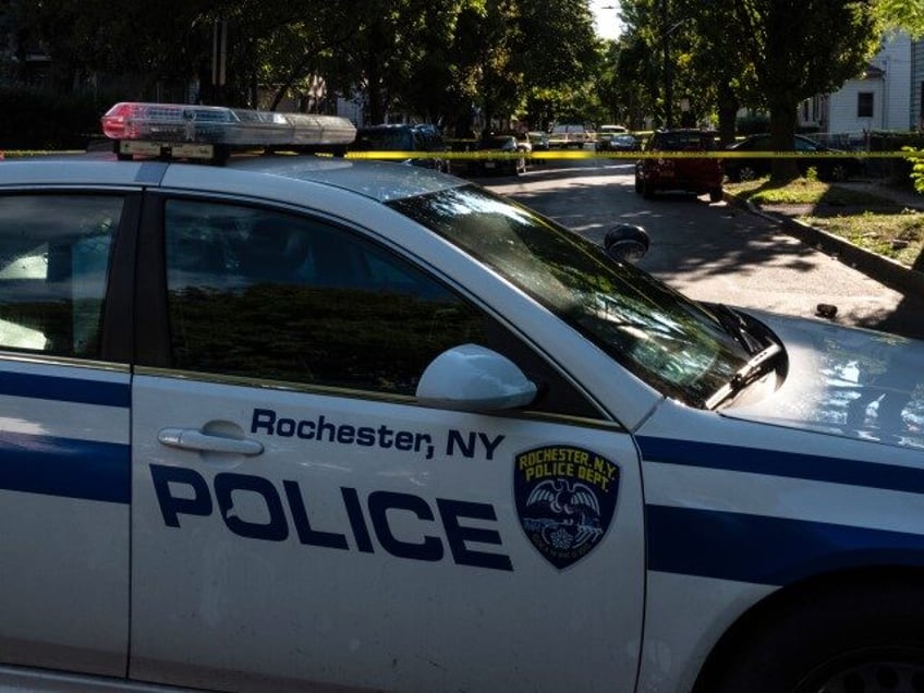 ROCHESTER, NY - SEPTEMBER 19: Police tape lines a crime scene after a shooting at a backya