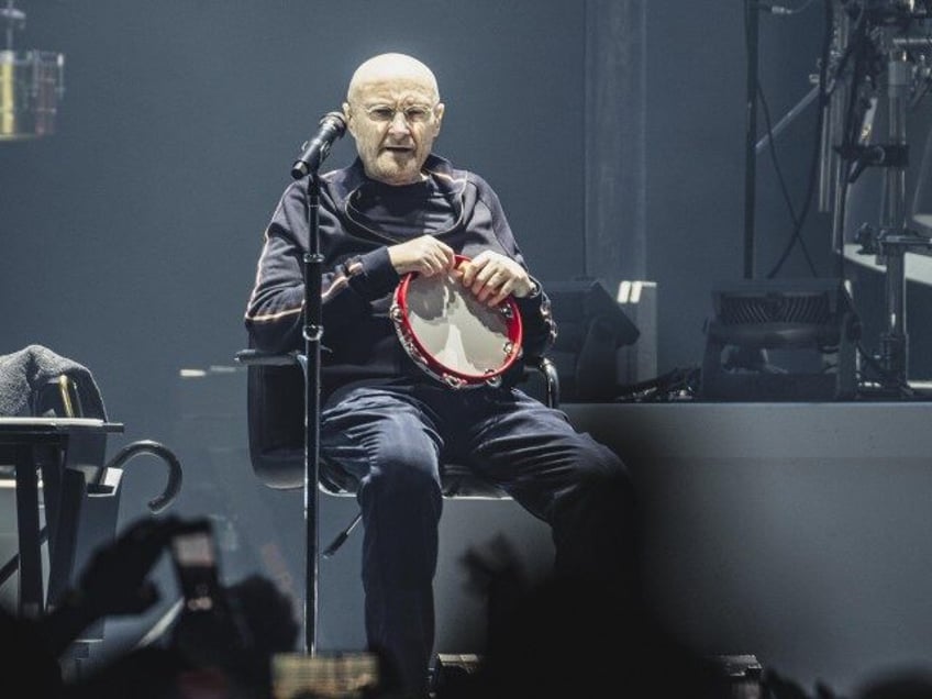 British singer and drummer Phil Collins of the band Genesis performs live on stage during