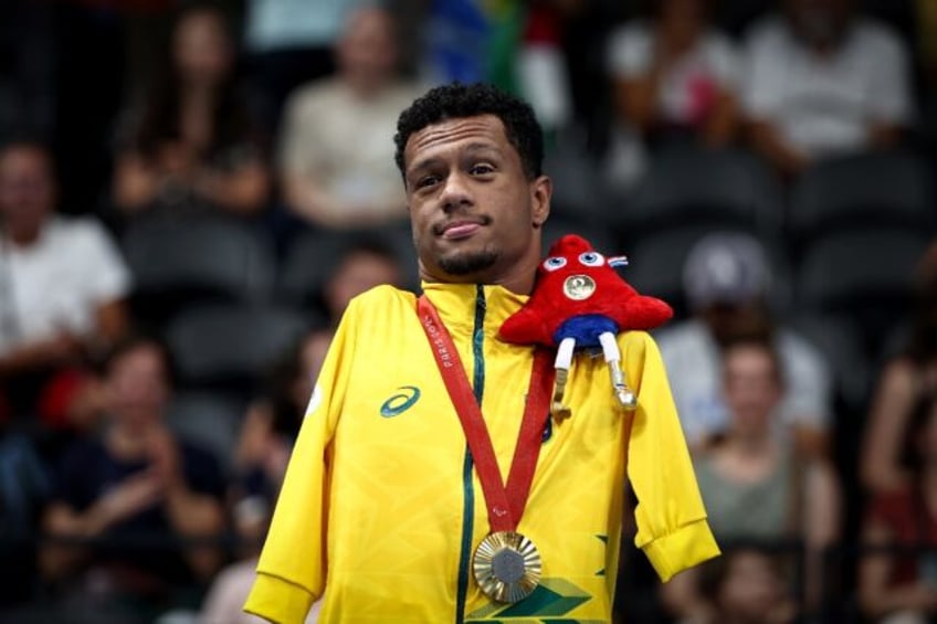 Gabriel Geraldo dos Santos Araujo, known as Gabrielzinho, takes the crowd's applause after