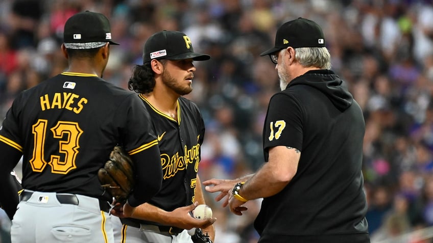 Pirates manager Derek Shelton walks to the mound