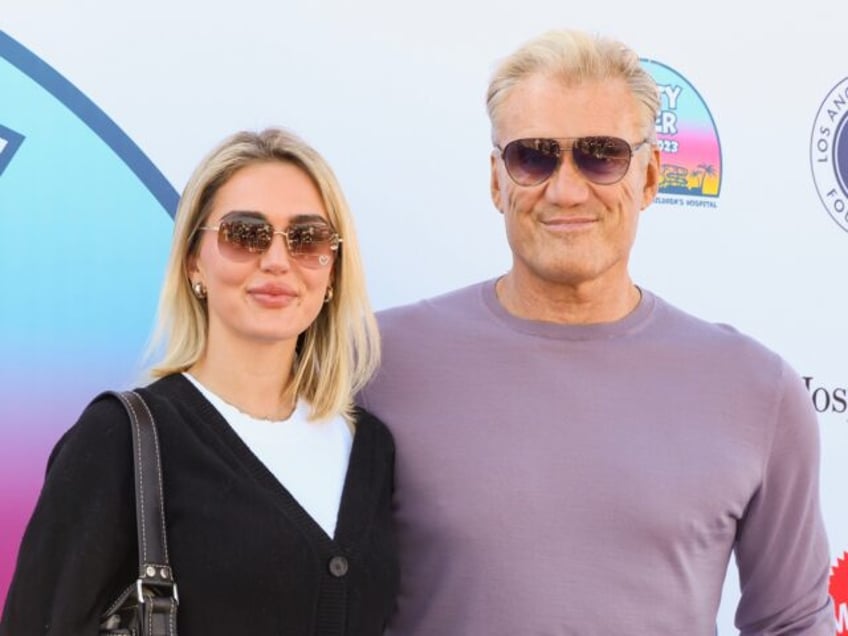 SANTA MONICA, CALIFORNIA - NOVEMBER 05: (L-R) Emma Krokdal and Dolph Lundgren attend UCLA