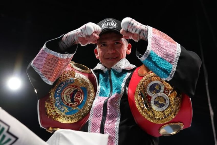 Jesse Rodriguez of the United States celebrates a technical knock out over Sunny Edwards of Britain to unify the IBF and WBA flyweight world titles in Glendale, Arizona