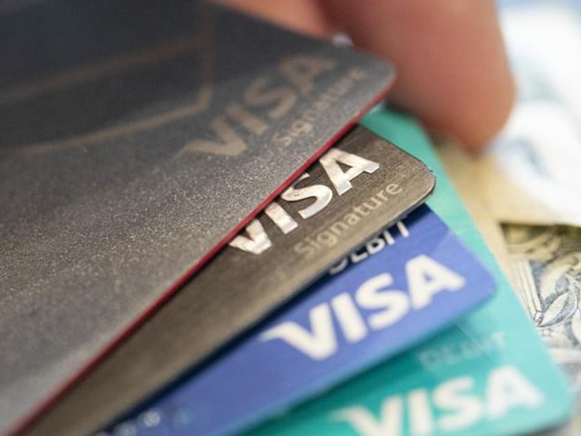 Visa credit cards are seen on Aug. 11, 2019, in New Orleans. Payment processor Visa Inc. said late Saturday, Sept. 10, 2022, that it plans to start separately categorizing sales at gun shops. (AP Photo/Jenny Kane, File)