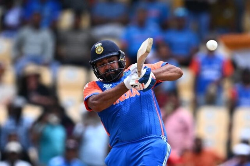 On the attack: India captain Rohit Sharma hits a four during his 92 against Australia in a