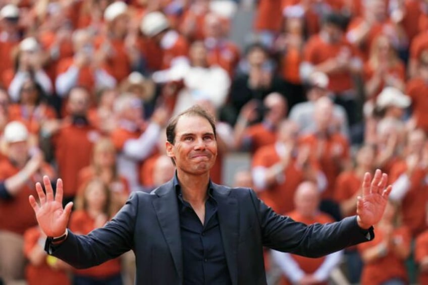 Rafael Nadal waves to the Court Philippe Chatrier crowd