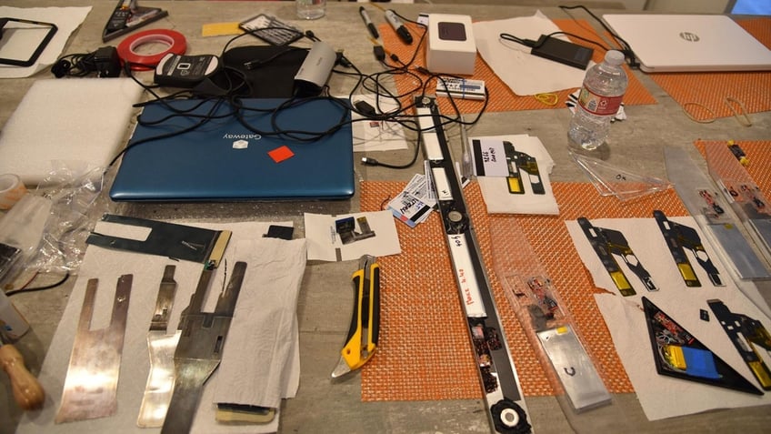 Thieves tools and skimming devices on a table