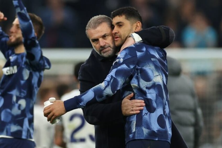 Tottenham boss Ange Postecoglou and defender Cristian Romero