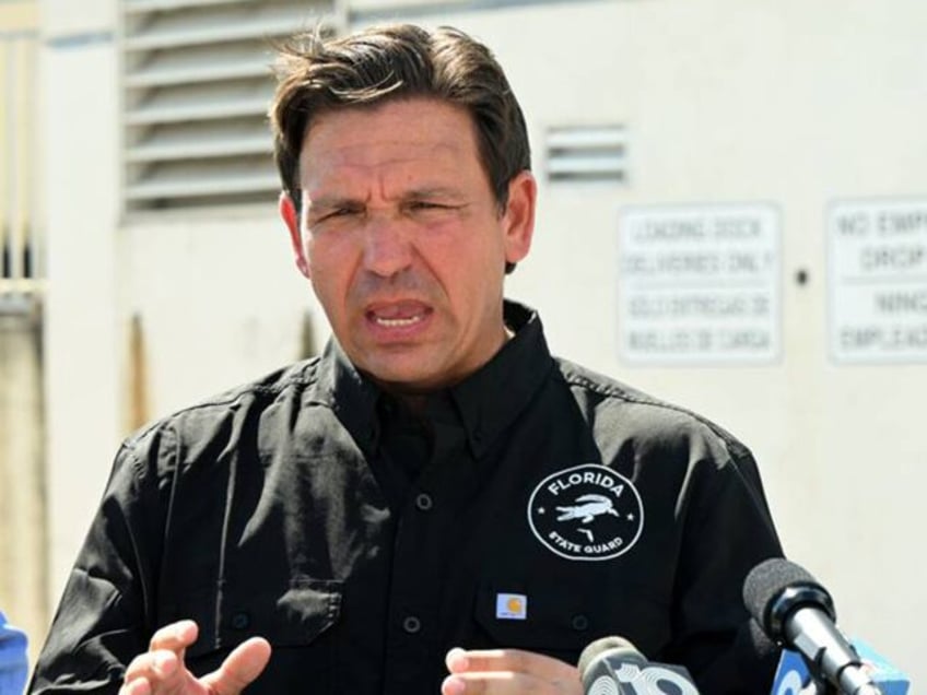 Florida Gov. Ron DeSantis, right, with FDEM Dir. Kevin Guthrie, left, spoke at a press con