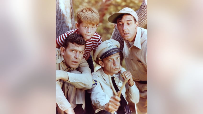  Andy Griffith as Sheriff Andy Taylor, Jim Nabors as Gomer Pyle, Ron Howard as Opie Taylor and Don Knotts as Deputy Barney Fife in The Andy Griffith Show, circa 1963. 