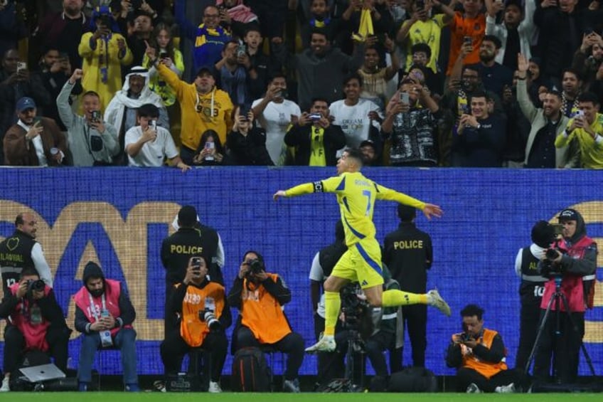Al Nassr's Portuguese forward Cristiano Ronaldo celebrates scoring in the Saudi Pro League