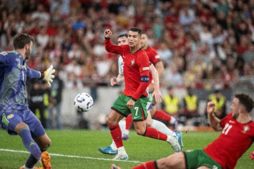 Portugal's Cristiano Ronaldo (C) scored the winner against Scotland