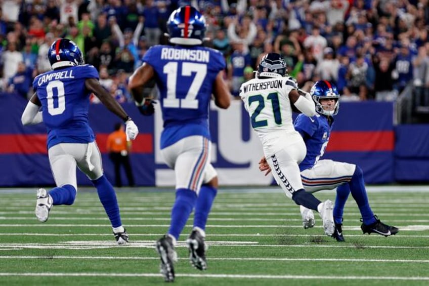 rookie devon witherspoon scores on 97 yard pick six as seahawks d leads seattle over giants