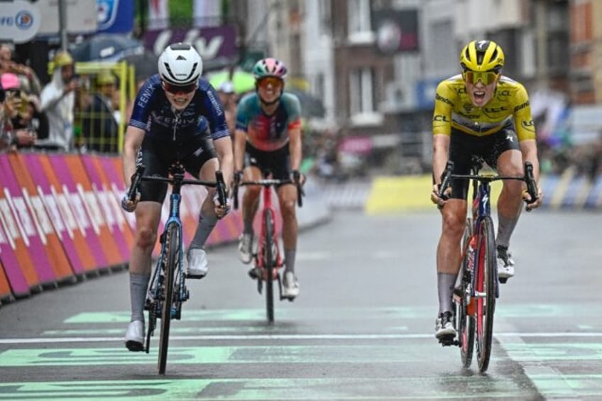 Puck Pieterse (L) crosses the finish line to win stage four of the women's Tour de France