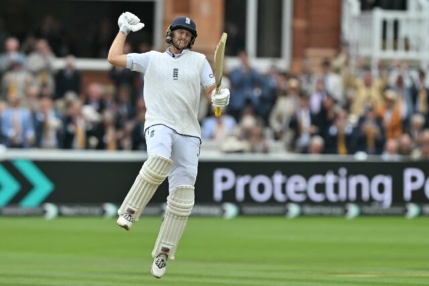 Joe Root celebrates his record-breaking century