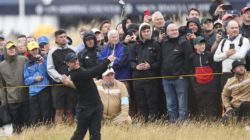 Rory McIlroy plays shot