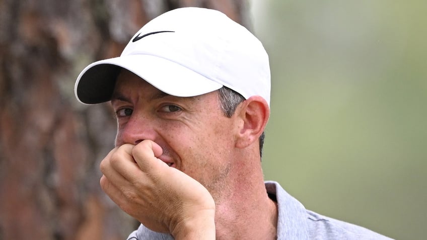 Rory McIlroy looks on course