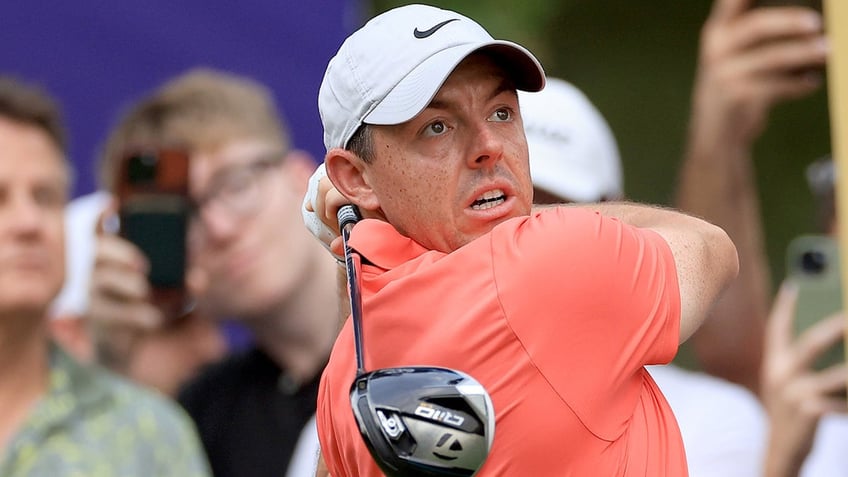 rory mcilroys wild shot at world tour championship lands in fans lap