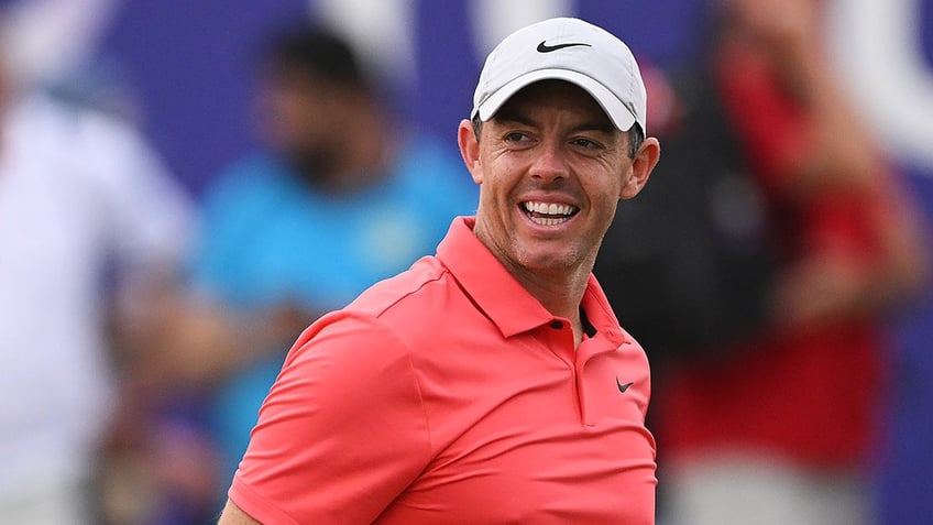 rory mcilroys wild shot at world tour championship lands in fans lap