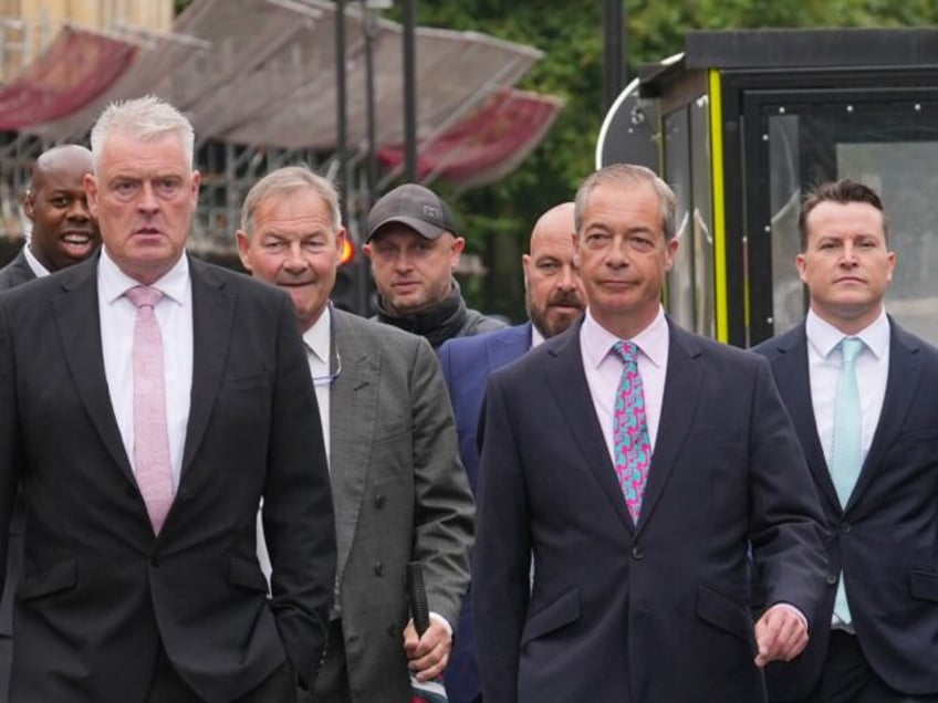 (Front row, left to right) Reform UK MP Lee Anderson, Reform UK leader Nigel Farage, and (
