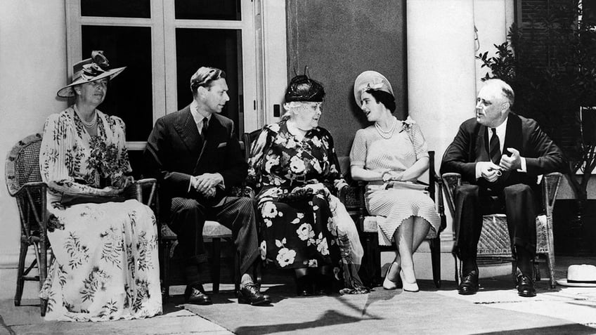 Queen Elizabeth, King George VI, FDR's mother, daughter, and Franklin Roosevelt sitting in a row in New York.