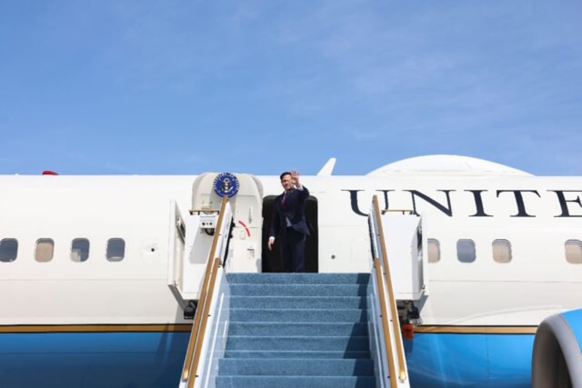 US Secretary of State Marco Rubio boards an aircraft, in Abu Dhabi on February 19