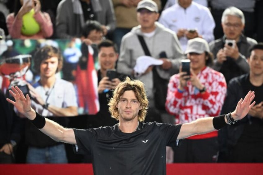 Andrey Rublev celebrates winning the Hong Kong Open against Finland's Emil Ruusuvuori