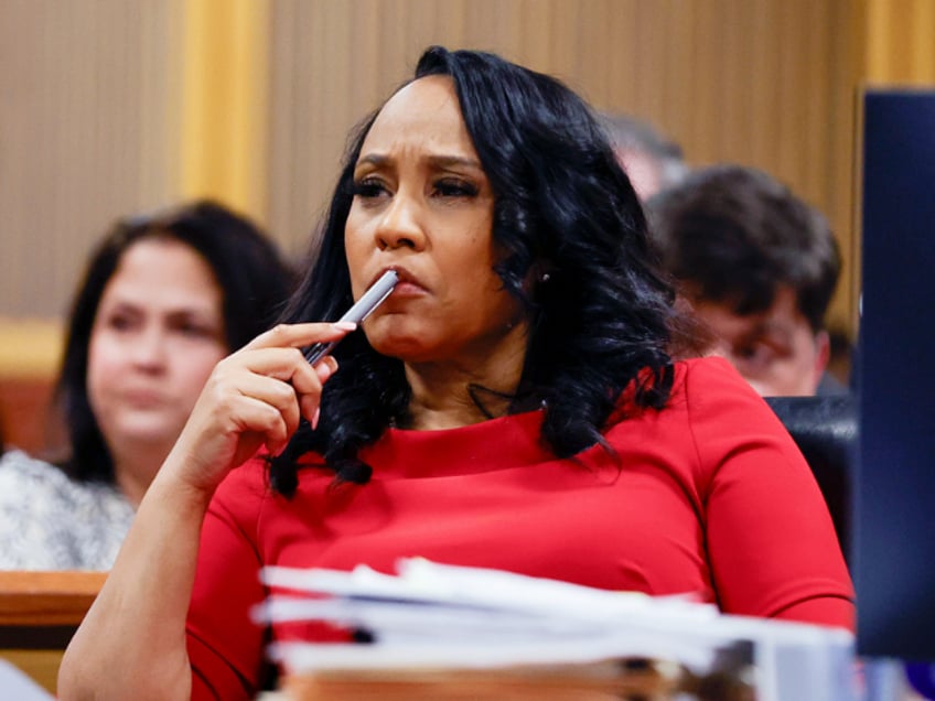 Fulton County District Attorney Fani Willis looks on during a hearing on the Georgia election interference case, Friday, March, 1, 2024, in Atlanta. The hearing is to determine whether Fulton County District Attorney Fani Willis should be removed from the case because of a relationship with Nathan Wade, special prosecutor she hired in the election interference case against former President Donald Trump. (AP Photo/Alex Slitz, Pool)