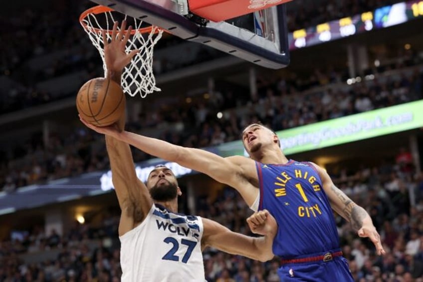 Minnesota's Rudy Gobert (left) blocks Denver's Michael Porter Jr; Gobert has been named NB