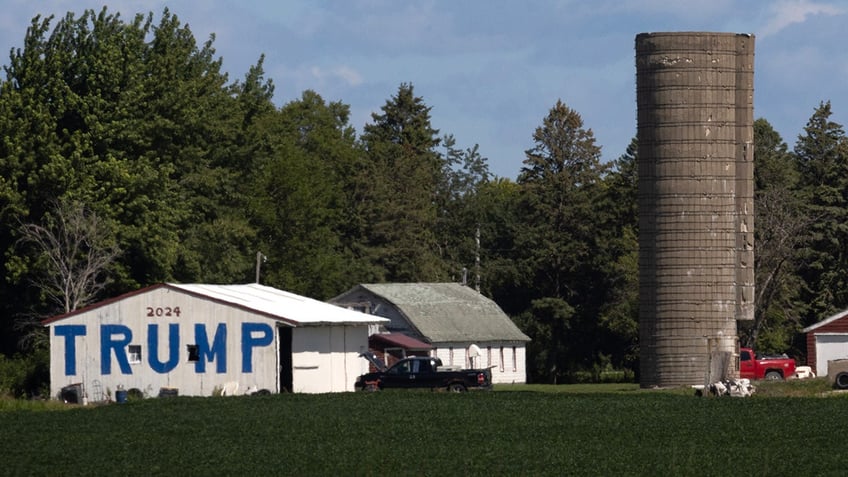 Giant Trump sign on side of barn in Iowa.