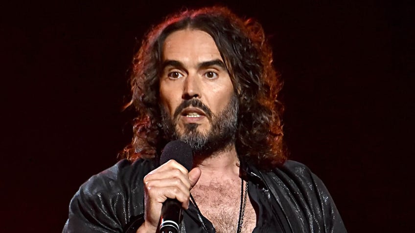 russell brand faces accusation of sexually assaulting extra on the set of his movie arthur in new lawsuit