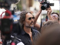 Russell Brand granted conditional bail after appearing in London court on rape and assault charges