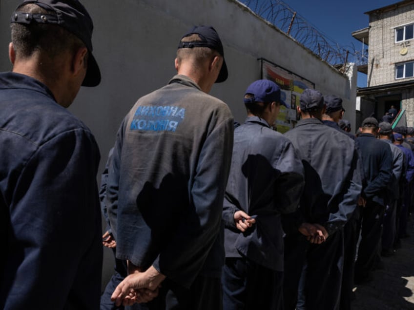 LVIV REGION, UKRAINE - AUGUST 3: Prisoners line up for lunch outside the Russian prisoner of war detention camp on August 3, 2023 in the Lviv region, Ukraine. Hundreds of captured Russian POWs including conscripts, mercenaries, Wagner militia and Storm-Z Russian prisoners are being held in up to 50 sites …