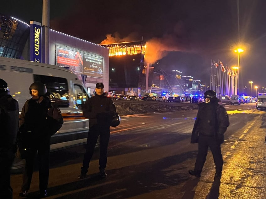 MOSCOW, RUSSIA - MARCH 22: Ambulances, personnel arrive at Crocus City Hall concert venue near Moscow, Russia after reports of a shooting incident on March 22, 2024. It was reported that several gunmen burst into a big concert hall in Moscow and fired weapons at the crowd, Russian Federal Security Service says 40 killed, 100 injured in shooting at Crocus City Hall in Moscow region. (Photo by Ali Cura/Anadolu via Getty Images)