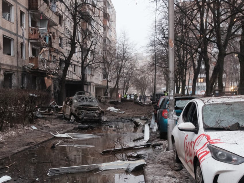 KYIV, UKRAINE - DECEMBER 13: Damaged cars and a residential apartment building are seen after a Russian missile attack on December 13, 2023 in Kyiv, Ukraine. On the night of December 13, Russian troops launched ballistic missiles at Kyiv. The air defense managed to shoot down all the targets, but …