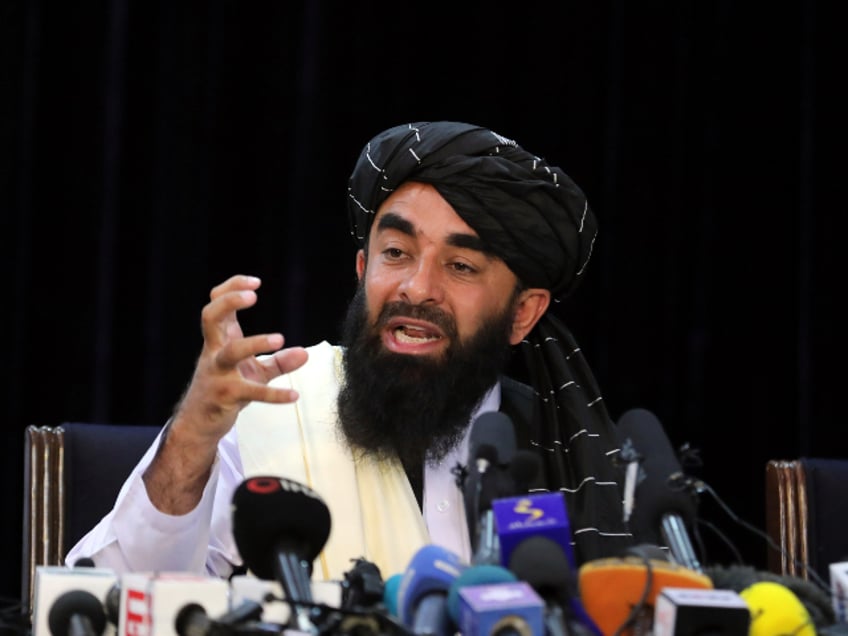 Taliban spokesman Zabihullah Mujahid speaks at his first news conference, in Kabul, Afghanistan, Tuesday, Aug. 17, 2021. For years, Mujahid had been a shadowy figure issuing statements on behalf of the militants. Mujahid vowed Tuesday that the Taliban would respect women's rights, forgive those who resisted them and ensure a secure Afghanistan as part of a publicity blitz aimed at convincing world powers and a fearful population that they have changed. (AP Photo/Rahmat Gul)