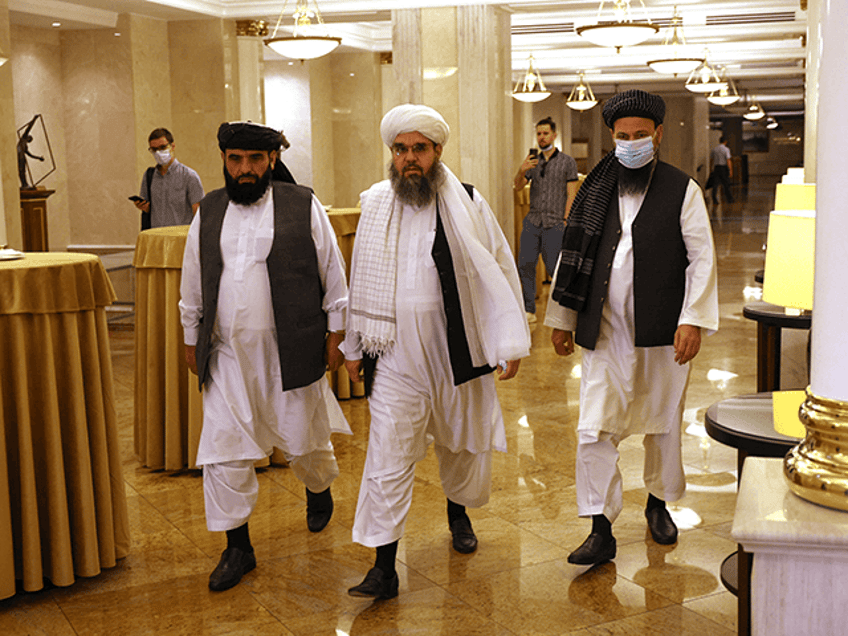 Leaders of the Taliban movement and negotiators Abdul Latif Mansoor (R), Shahabuddin Delawar (C) and Suhail Shaheen (L) walk to attend a press conference in Moscow on July 9, 2021. - Russia on July 9, 2021, said the Taliban controls about two-thirds of the Afghan-Tajik border and urged all sides in Afghanistan to show restraint. (Photo by Dimitar DILKOFF / AFP) (Photo by DIMITAR DILKOFF/AFP via Getty Images)