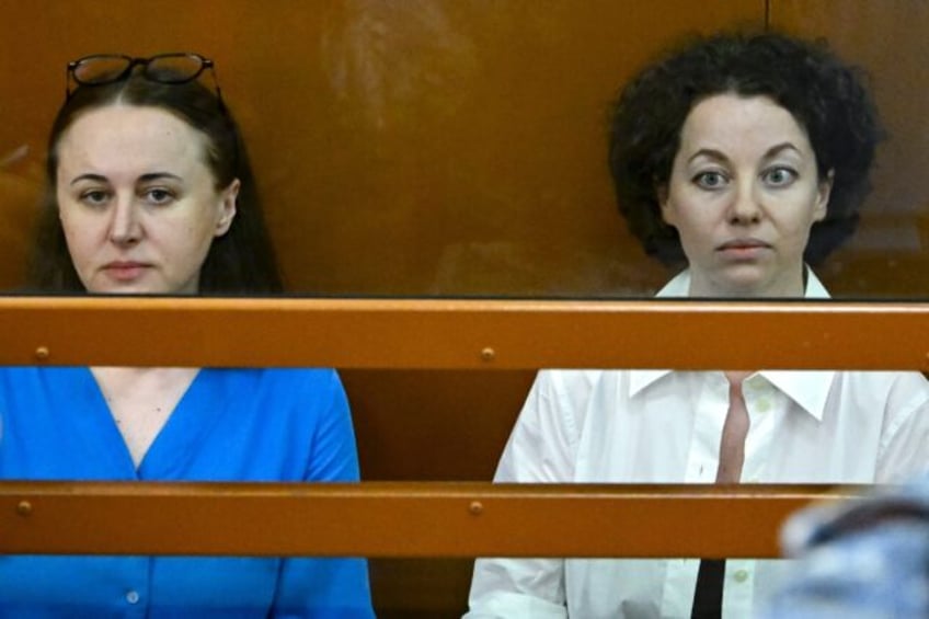 Russian theatre director Yevgeniya Berkovich (R) and playwright Svetlana Petriychuk sit in