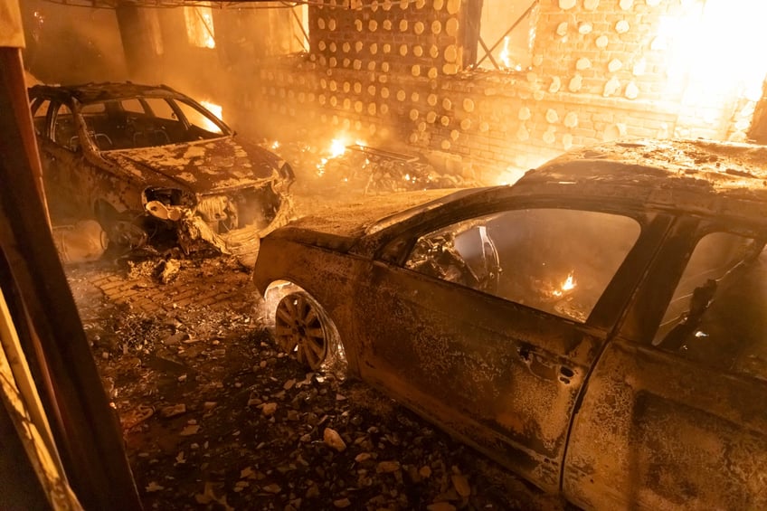 Burnt out cars after a Russian attack on a residential neighborhood in Kharkiv, Ukraine Saturday, Feb. 10, 2024. (AP Photo/Yevhen Titov)