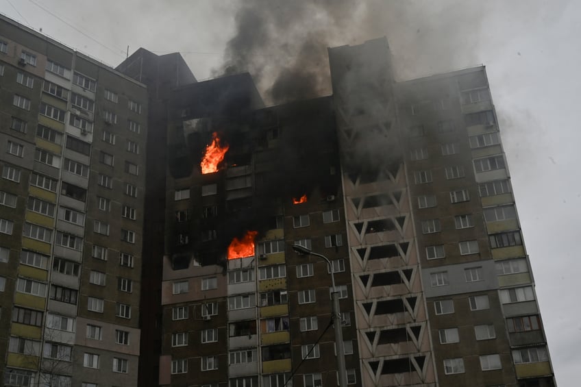 TOPSHOT - This photograph taken in Kyiv on February 7, 2024, shows a burning building damaged as a result of missile attack, amid the Russian invasion of Ukraine. At least three people were killed in a "massive" wave of Russian missile and drone attacks across Ukraine early on February 7, 2024, President Volodymyr Zelensky said. (Photo by Sergei SUPINSKY / AFP) (Photo by SERGEI SUPINSKY/AFP via Getty Images)