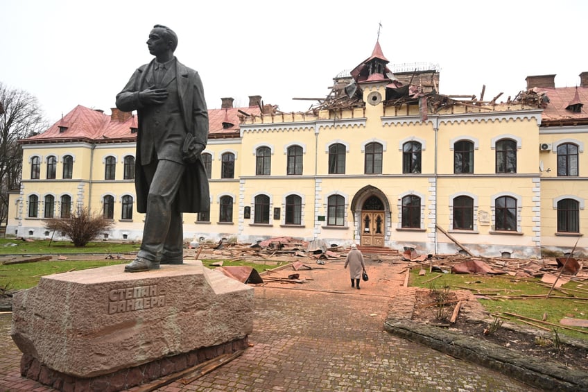 A woman walks towards the damaged Lviv National University of Nature Management, after a drone attack in Dubliany on the outskirt of Lviv on January 1, 2024, amid the Russian invasion of Ukraine. Ukraine said on January 1, 2024 it had foiled a "record" number of Russian drones on the night of New Year's Eve after a week of escalation in the nearly two-year conflict. (Photo by YURIY DYACHYSHYN / AFP) (Photo by YURIY DYACHYSHYN/AFP via Getty Images)