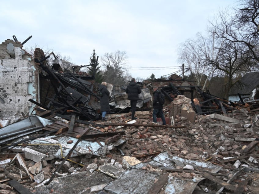 People stand among the debris of the destroyed Shukhevych Museum after a drone attack in Bilogorshchethe, on the outskirt of Lviv on January 1, 2024, amid the Russian invasion of Ukraine. The museum was named after UPA Corporal General Roman Shukhevych (19071950), the leader of the Ukrainian Insurgent Army. Andriy …