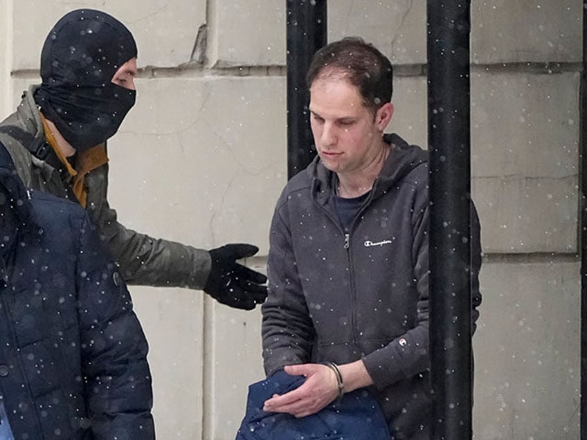 Wall Street Journal reporter Evan Gershkovich is escorted from a court hearing in Moscow,