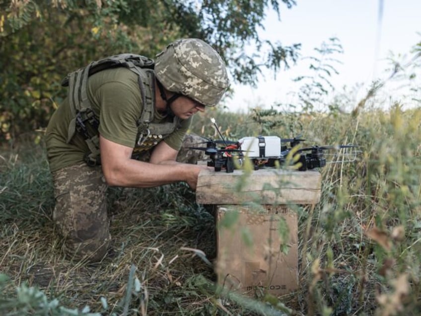 LUHANSK, UKRAINE - AUGUST 25: Ukrainian soldiers prepare FPV drones as military mobility o