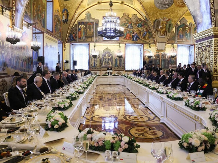In this pool photograph distributed by the Russian state agency Sputnik, Russia's Pre
