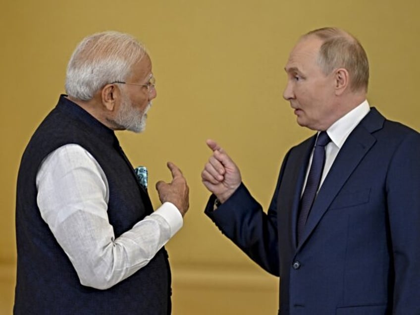 MOSCOW, RUSSIA - JULY 09: Russian President Vladimir Putin (R) and the Indian Prime Minist