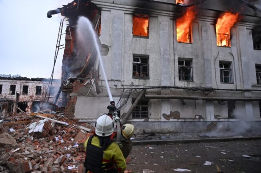 Firefighters extinguish a blaze in Kharkiv, Ukraine*s second-largest city before dawn