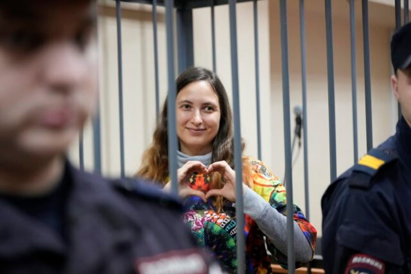 russian court convicts a woman for protesting the war in ukraine in latest crackdown on free speech