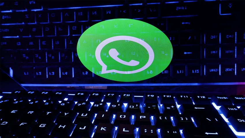 WhatsApp in front of a keyboard