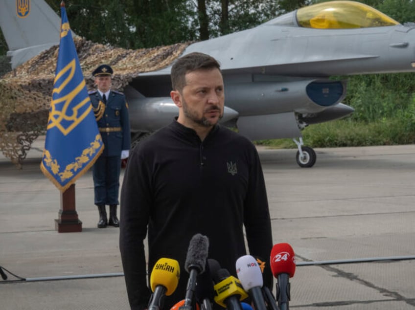 Ukraine's President Volodymyr Zelenskyy answers media questions standing against the